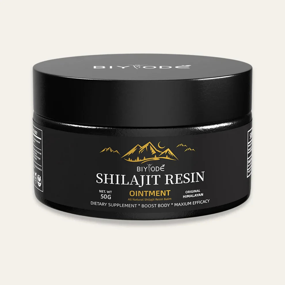 Shilajit resin dissolving in a cup of warm water,   forming a rich brown mineral tonic"
