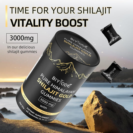 "Person taking a Shilajit Gummy in the morning with 
tea and supplements on a wellness tray.